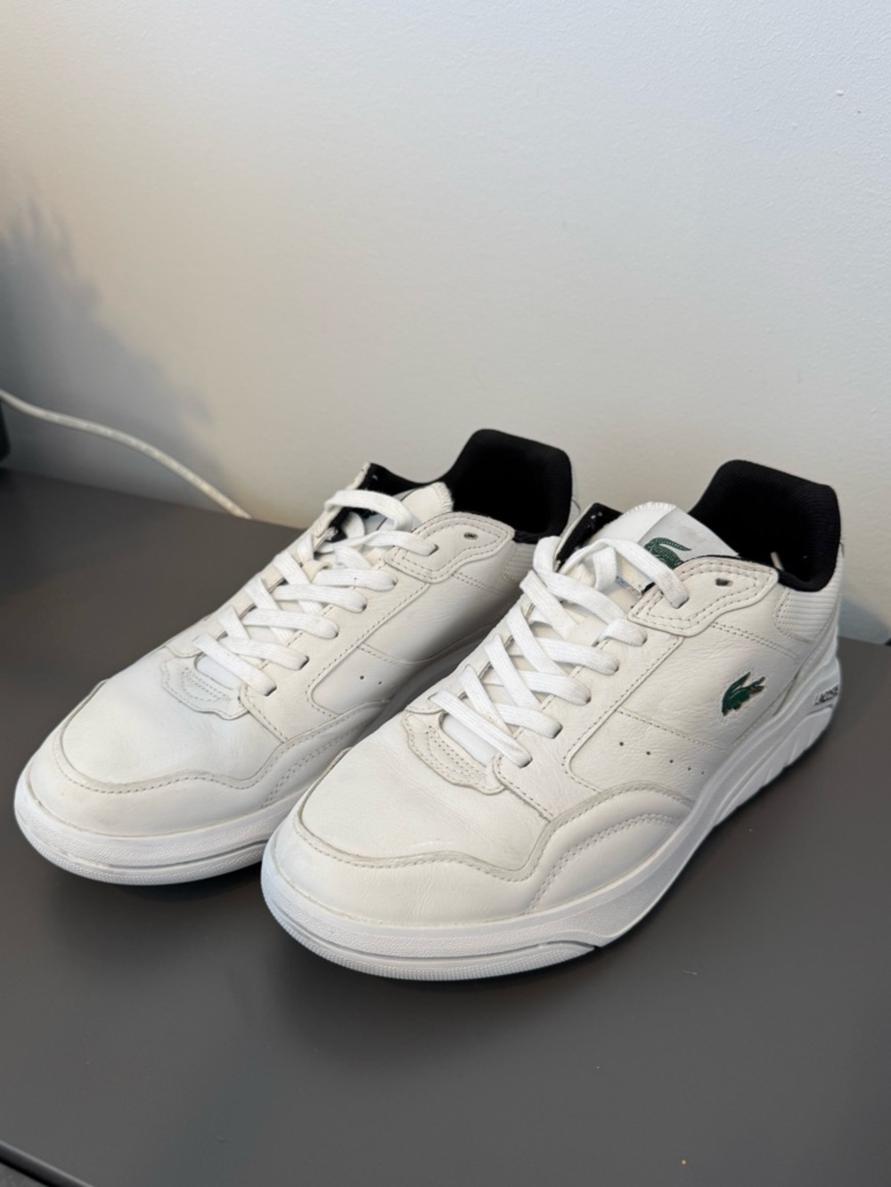 Lacoste White Leather Sneakers with Black Collar and Green Logo